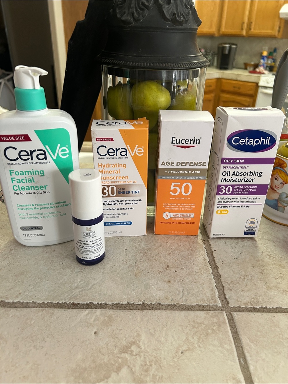 Kiehl's Small White and Blue Skincare Bottle with Assorted Sunscreen Boxes